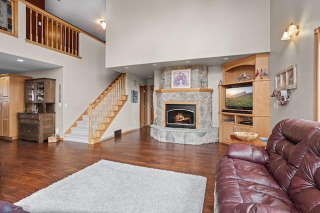 6435 172nd Ave SE, Colfax, ND 58018 - living area with a high ceiling, a stone fireplace, wood finished floors, and stairway