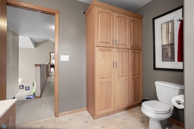 6435 172nd Ave SE, Colfax, ND 58018 - bathroom featuring baseboards and toilet