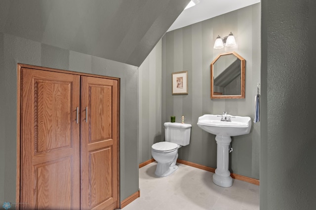 6435 172nd Ave SE, Colfax, ND 58018 - bathroom with baseboards and toilet