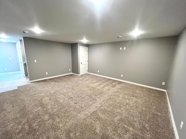 finished below grade area featuring carpet and baseboards