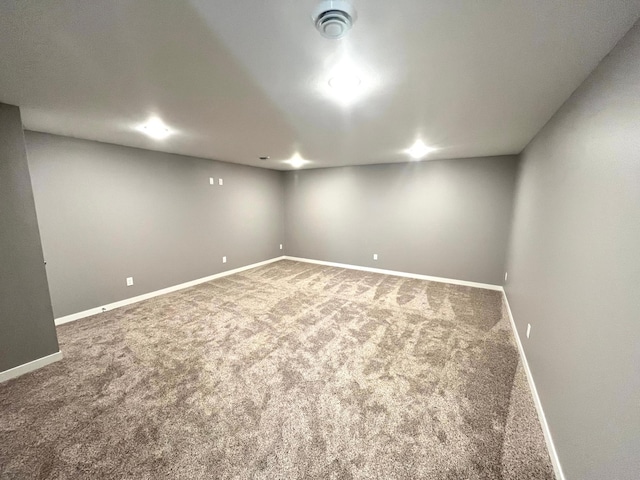 finished below grade area featuring carpet and baseboards