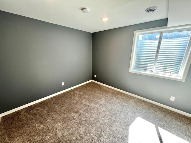 unfurnished room with carpet flooring, baseboards, and recessed lighting