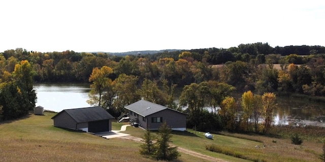 aerial view with a water view and a view of trees