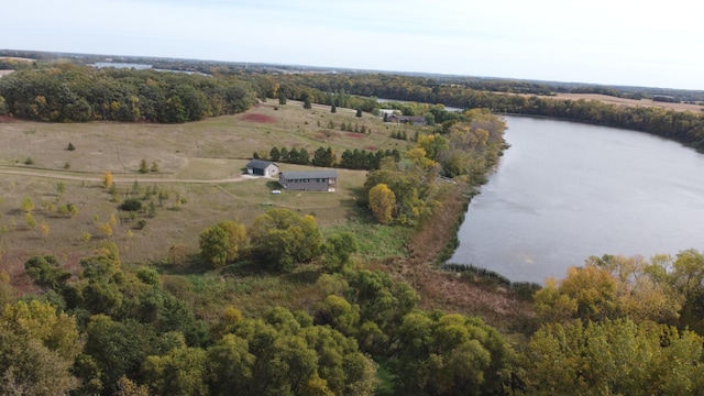 bird's eye view featuring a wooded view, a water view, and a rural view