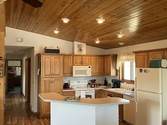 kitchen featuring a sink, light countertops, white appliances, and lofted ceiling