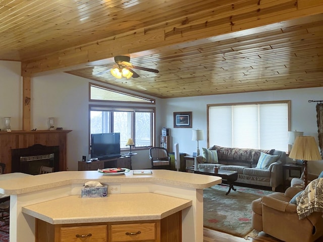 kitchen featuring open floor plan, wood ceiling, vaulted ceiling, and light countertops