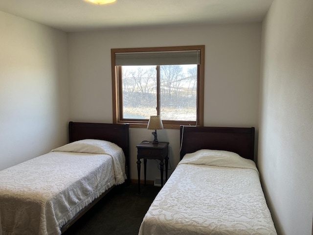 bedroom featuring dark colored carpet