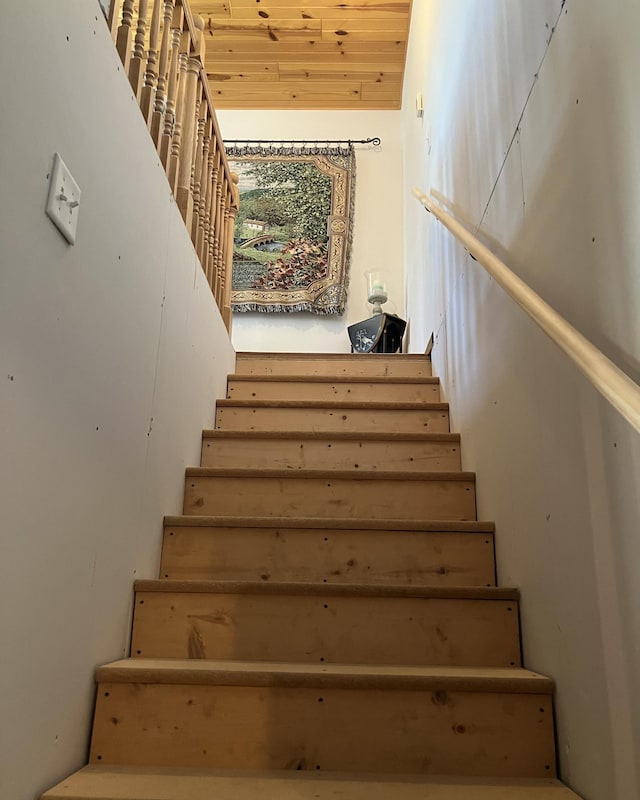 stairs with wooden ceiling