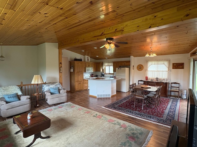 27588 226th St, Underwood, MN 56586 - living area with dark wood finished floors, a ceiling fan, wooden ceiling, and vaulted ceiling