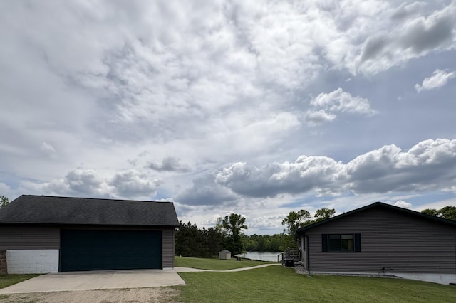 27588 226th St, Underwood, MN 56586 - view of green lawn featuring an outdoor structure and a garage