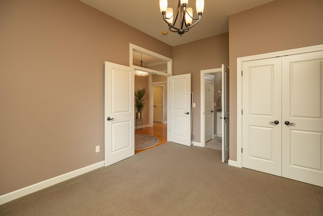 4051 Autumn Lake Ct SW, Rochester, MN 55902 - unfurnished bedroom featuring carpet floors, a chandelier, and a closet
