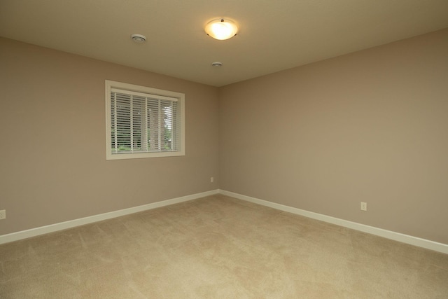 4051 Autumn Lake Ct SW, Rochester, MN 55902 - spare room featuring light carpet and a smoke detector