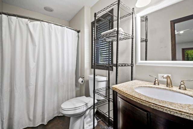full bathroom featuring toilet, vanity, and a shower with curtain