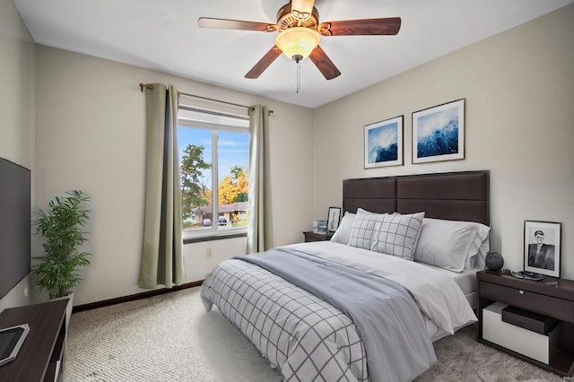 bedroom with carpet, baseboards, and ceiling fan