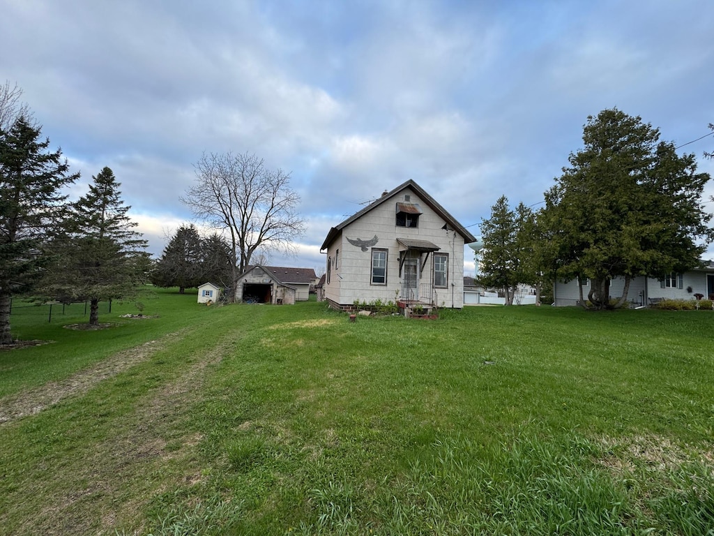 2330 Kenyon Rd, Owatonna, MN 55060 - back of house featuring a lawn
