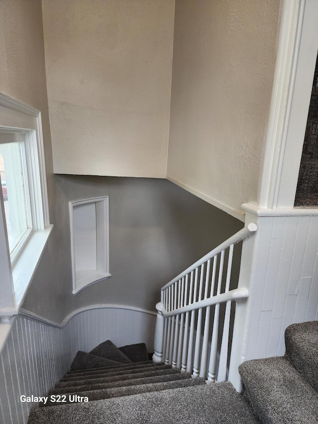 238 Lincoln St, Mankato, MN 56001 - staircase with a wainscoted wall