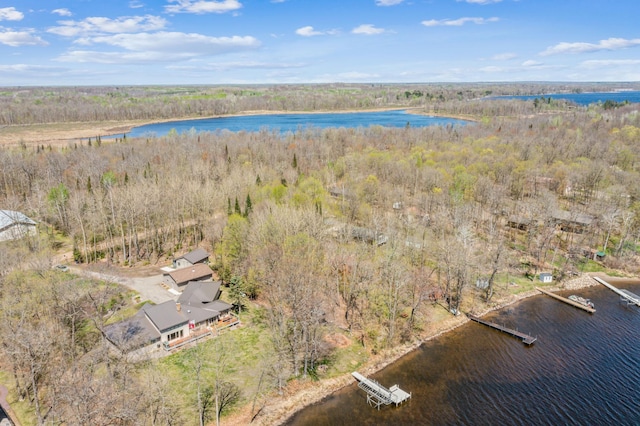bird's eye view of a nearby body of water and a heavily wooded area