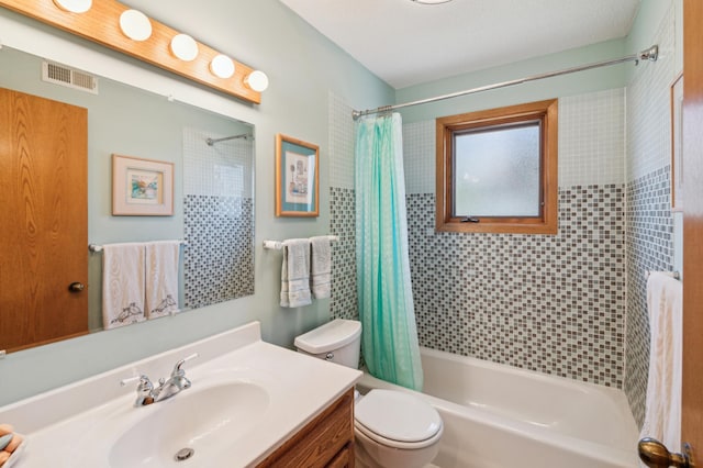 full bath with shower / bath combo, toilet, and vanity