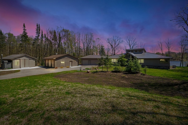 30501 336th Ln, Aitkin, MN 56431 - mid-century inspired home featuring a detached garage, an outbuilding, a front yard, and metal roof