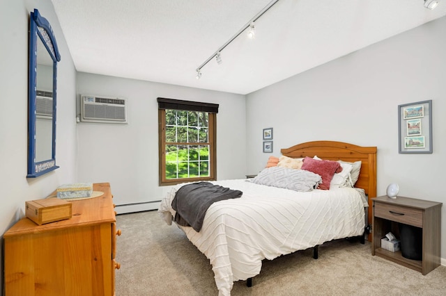 4508 Cedar Lake Rd S Unit 2, Saint Louis Park, MN 55416 - carpeted bedroom featuring rail lighting, a wall mounted AC, and a baseboard radiator