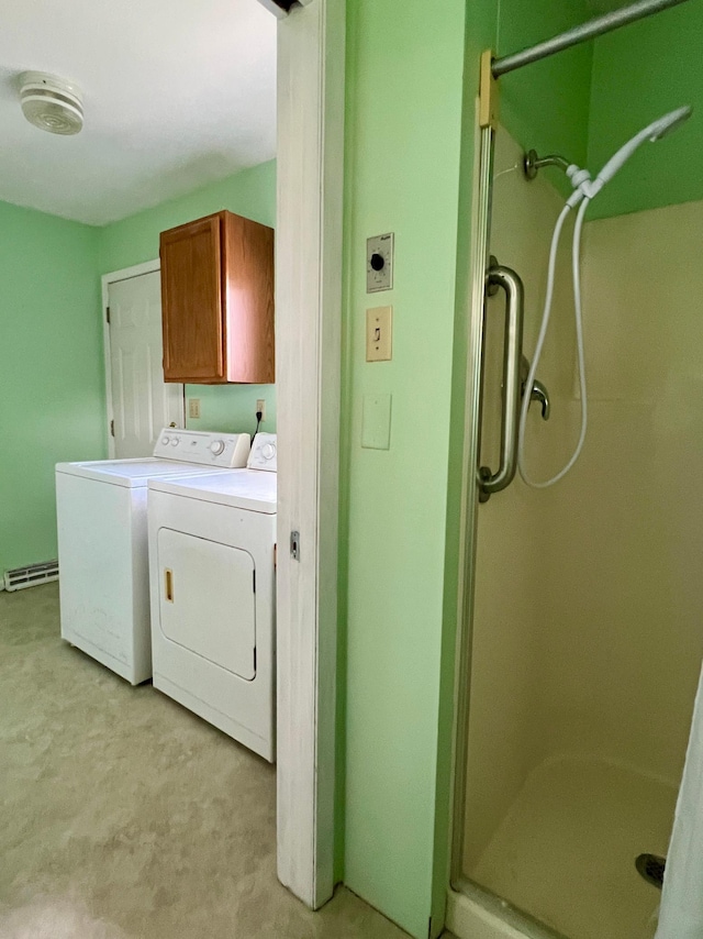1207 3rd Ave S, Wheaton, MN 56296 - clothes washing area with a baseboard heating unit, laundry area, light colored carpet, and washing machine and dryer