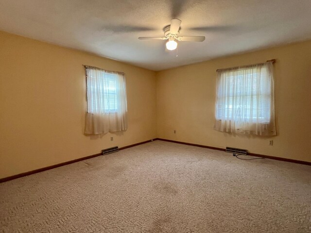 1207 3rd Ave S, Wheaton, MN 56296 - spare room featuring carpet flooring, ceiling fan, and visible vents