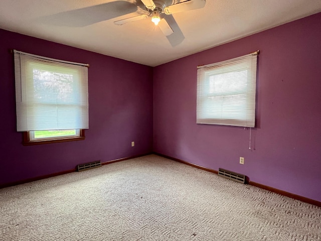 1207 3rd Ave S, Wheaton, MN 56296 - empty room with carpet floors, ceiling fan, and visible vents