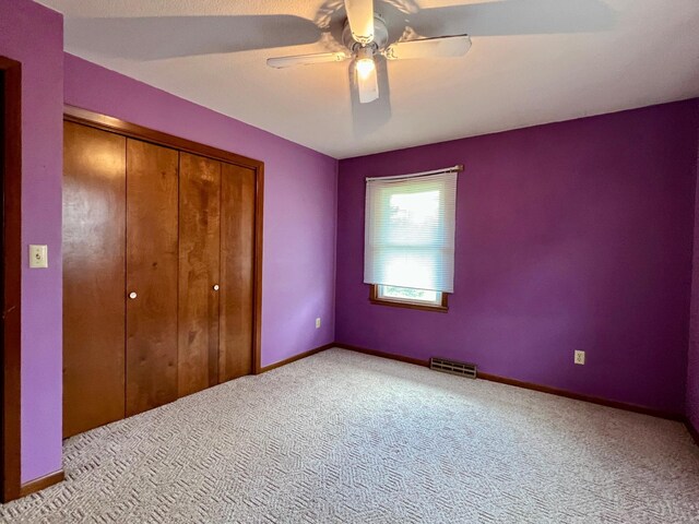 1207 3rd Ave S, Wheaton, MN 56296 - unfurnished bedroom featuring carpet flooring, baseboards, visible vents, and a closet