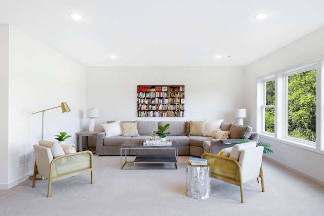 living room featuring baseboards, carpet flooring, and recessed lighting