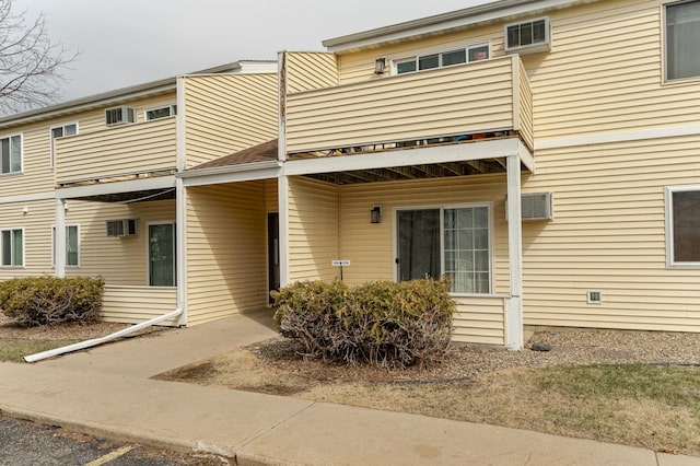 view of front of house featuring a balcony