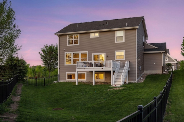 rear view of house featuring stairway and a wooden deck