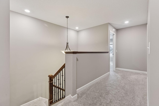 6573 Bridle Path, Corcoran, MN 55340 - hall with carpet floors, baseboards, recessed lighting, and an upstairs landing