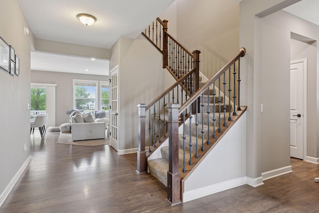 6573 Bridle Path, Corcoran, MN 55340 - stairs with hardwood / wood-style floors and baseboards