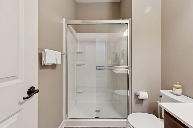 6573 Bridle Path, Corcoran, MN 55340 - bathroom with a shower stall, toilet, and vanity