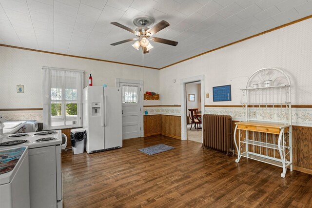 52905 Deerwood Ave, Rush City, MN 55069 - kitchen with white appliances, radiator, crown molding, a wainscoted wall, and ceiling fan