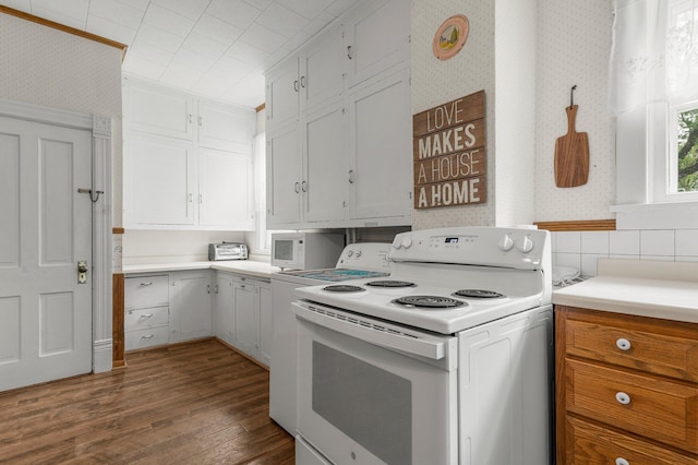 52905 Deerwood Ave, Rush City, MN 55069 - kitchen with wallpapered walls, white appliances, dark wood finished floors, light countertops, and white cabinets
