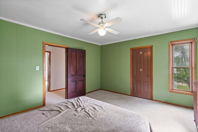 52905 Deerwood Ave, Rush City, MN 55069 - carpeted bedroom featuring baseboards, crown molding, a ceiling fan, and wood walls