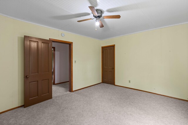 52905 Deerwood Ave, Rush City, MN 55069 - unfurnished bedroom featuring light carpet, baseboards, and a ceiling fan