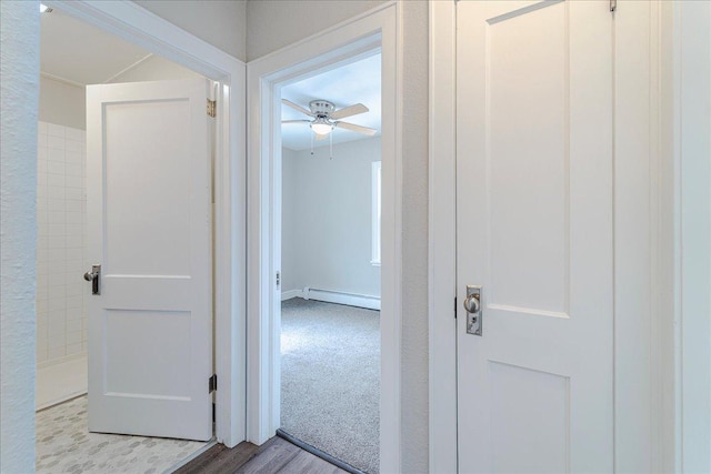 hall featuring baseboard heating