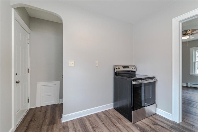 washroom with ceiling fan, arched walkways, baseboards, and wood finished floors