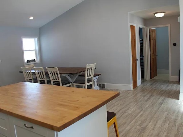 dining room featuring recessed lighting, baseboards, light wood-type flooring, and visible vents