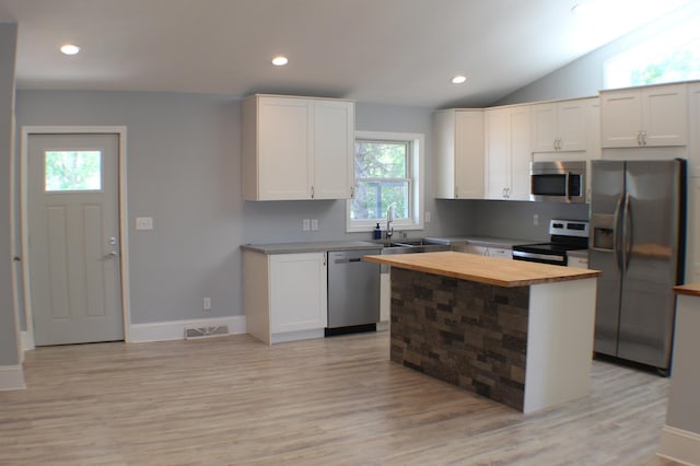 29789 20th Avenue Way, Stanton Twp, MN 55009 - kitchen with stainless steel appliances, butcher block counters, light wood-style flooring, white cabinetry, and recessed lighting