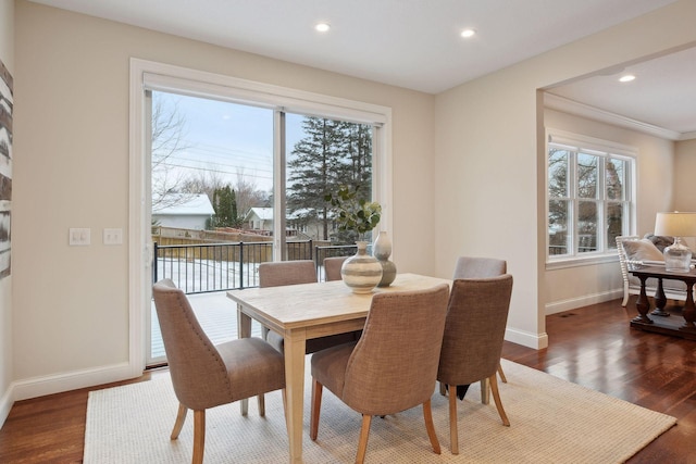 dining room featuring recessed lighting, baseboards, and wood finished floors