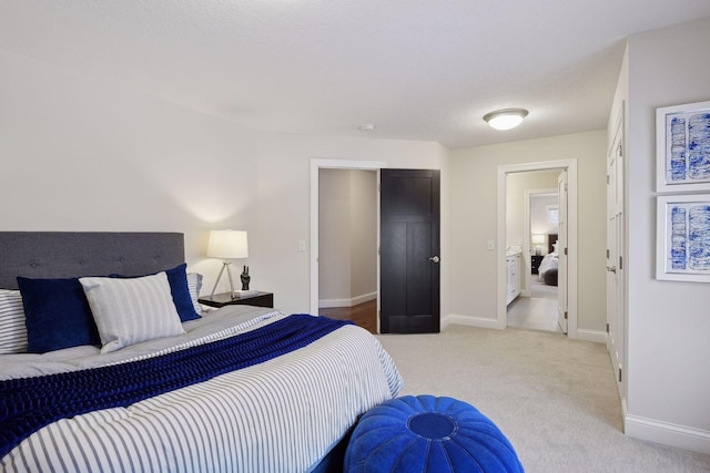 carpeted bedroom featuring baseboards