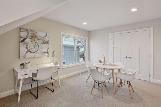 dining space with baseboards, light carpet, and recessed lighting