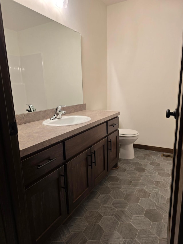 10815 190th Ln NW, Elk River, MN 55330 - bathroom with vanity, visible vents, and toilet
