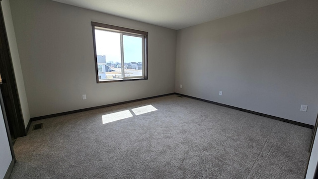 10815 190th Ln NW, Elk River, MN 55330 - spare room featuring visible vents, baseboards, and carpet floors