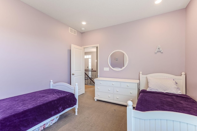 bedroom with recessed lighting, visible vents, and light carpet