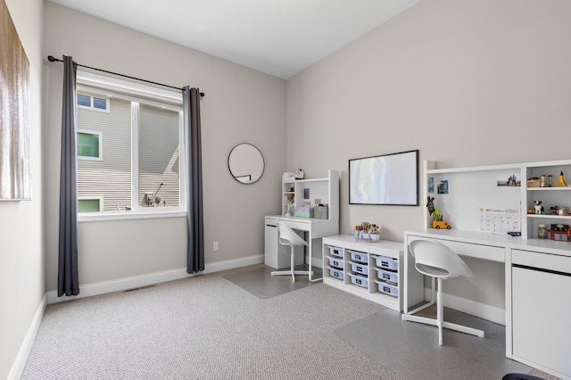 office area featuring baseboards and built in desk