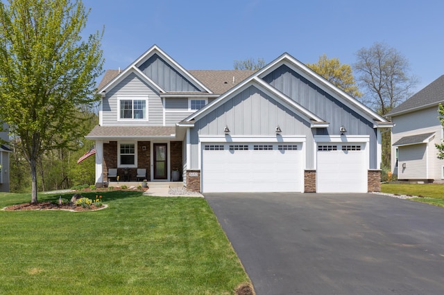5652 Mount Curve Blvd SE, Prior Lake, MN 55372 - craftsman-style home featuring board and batten siding, asphalt driveway, a garage, and stone siding